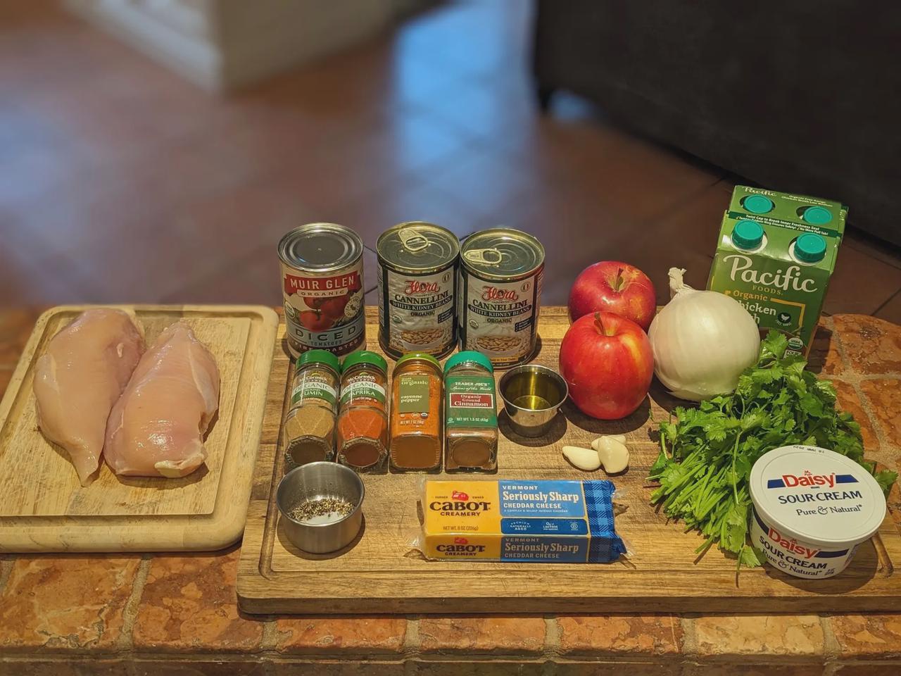 Platter of ingredients for Apple-Cinnamon Chicken Chili on a cutting board.