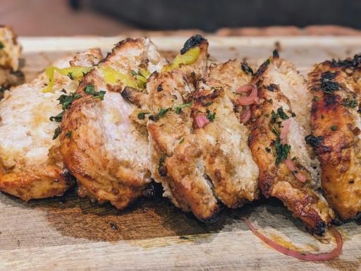 Chicken cutlets layered with bread crumbs and skewered.