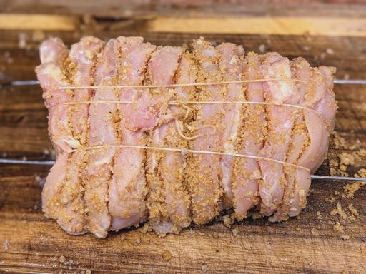 Chicken cutlets layered with bread crumbs and skewered.