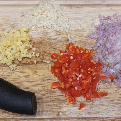 A photo of the shallots, garlic, ginger, and chili minced and ready to be sautéed.