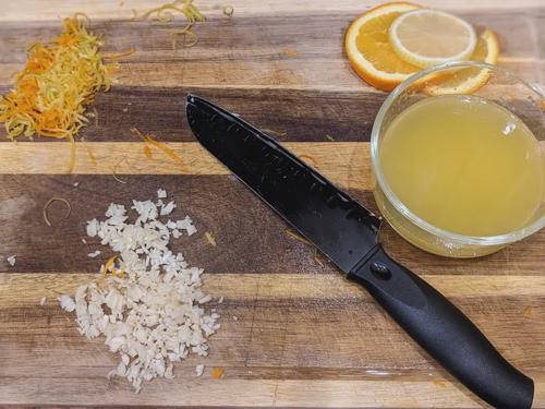 Chopped zest and garlic, and orange juice.