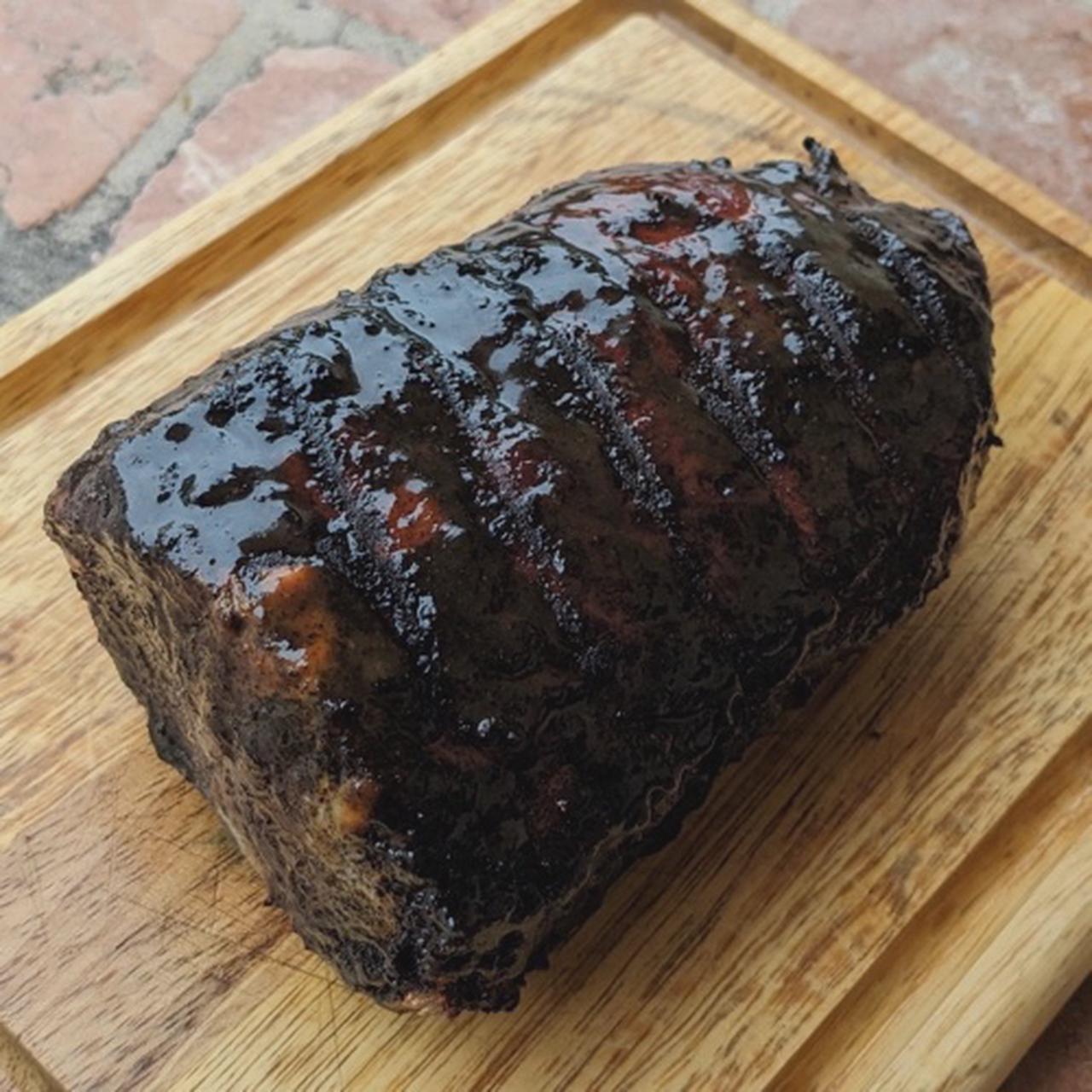 A perfectly grilled coffee and brown sugar rubbed pork loin roast, glazed with a sweet apple cider glaze.