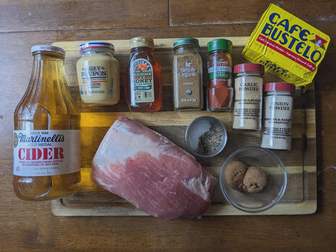 Platter of ingredients for grilled pork loin roast recipe with a rich coffee and brown sugar rub.