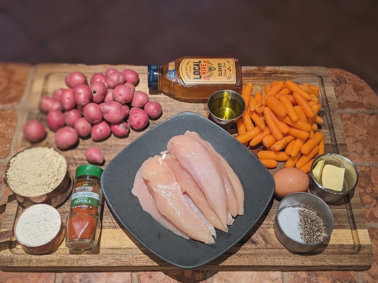 Ingredients for Crispy Baked Chicken Tenders, Honey-Glazed Carrots, and Crispy Roasted Potatoes