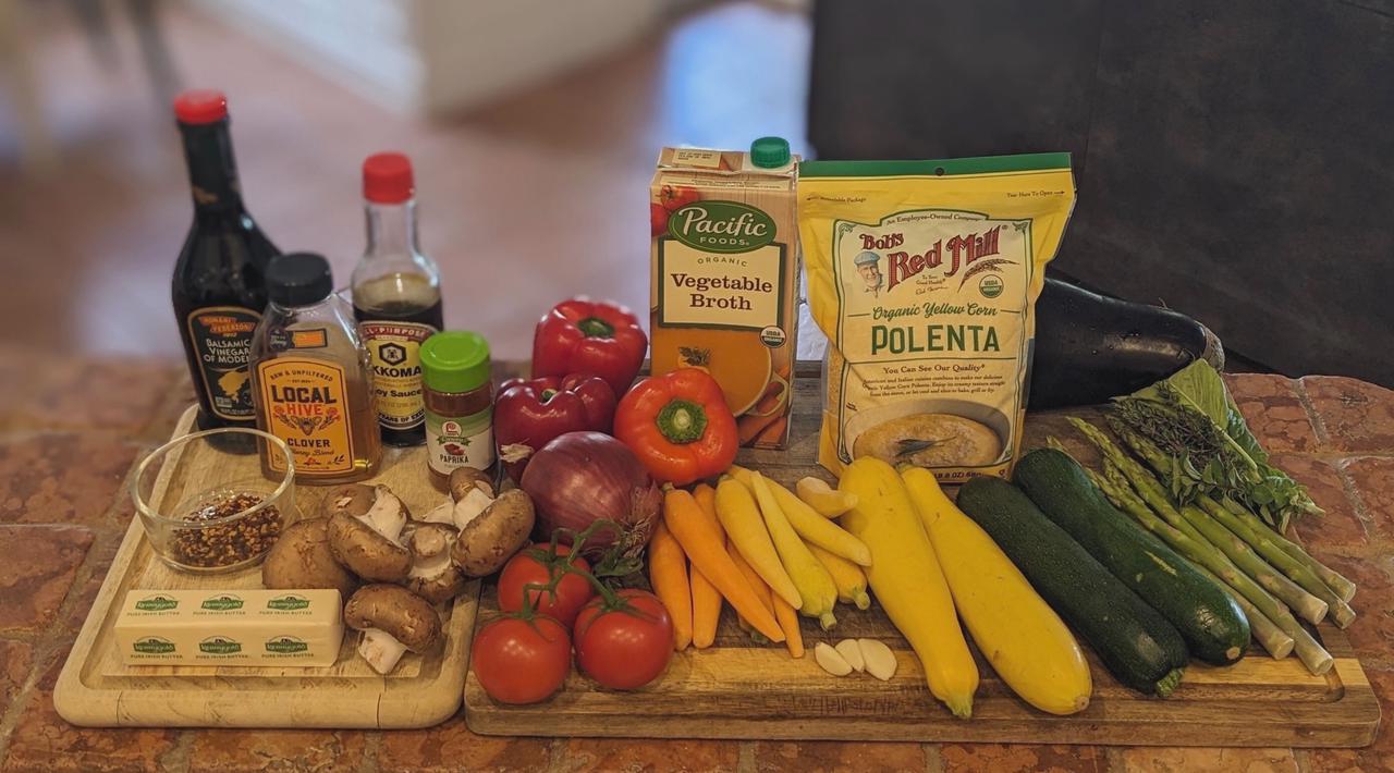 Platter of ingredients for Grilled Polenta and Rainbow Vegetables with Magic Marinade on a cutting board.