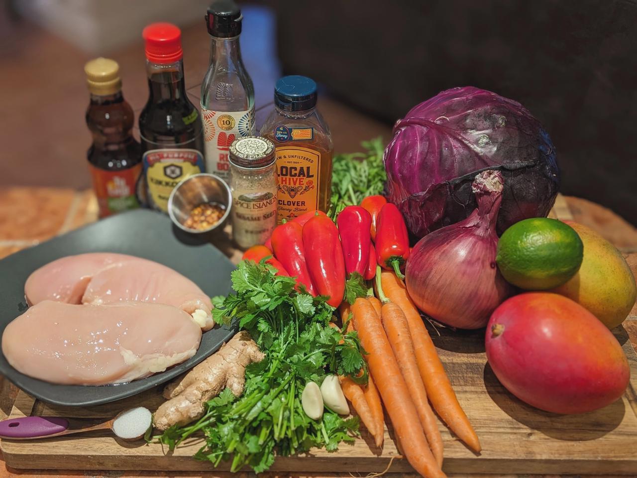 Platter of ingredients for the Honey-Sesame Crusted Chicken with Spicy Mango Slaw recipe.