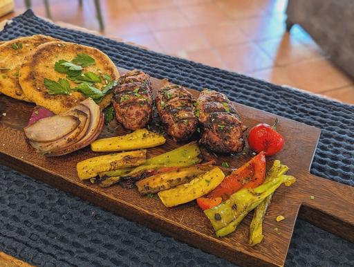 Lamb kofta skewers, grilled vegetables, and high-fiber pita bread.